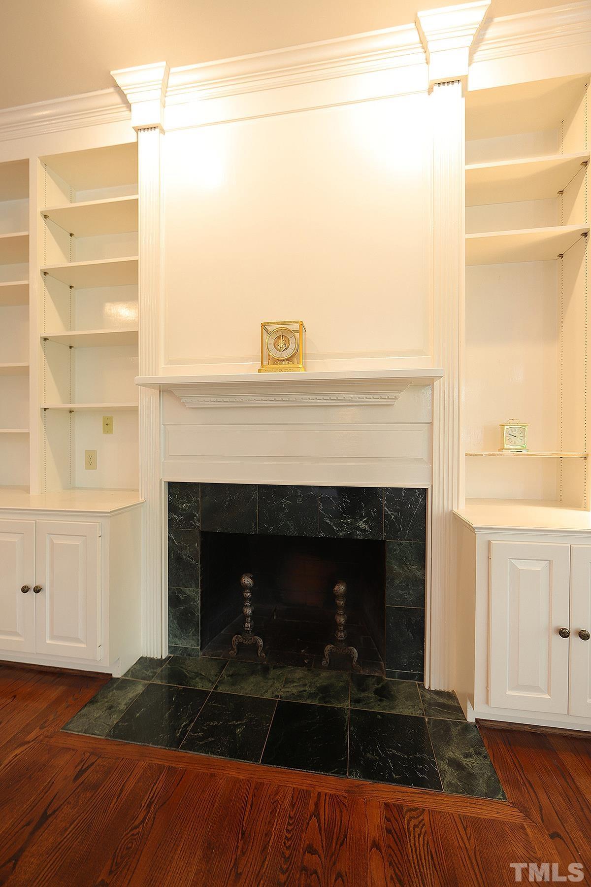 7600 Pinewild Court Raleigh, NC 27615 - Photo 14 of 52 a living room with a fireplace