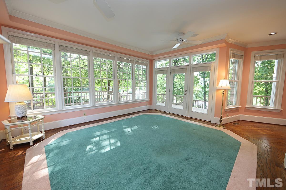 7600 Pinewild Court Raleigh, NC 27615 - Photo 16 of 52 a living room with hardwood floor and large window