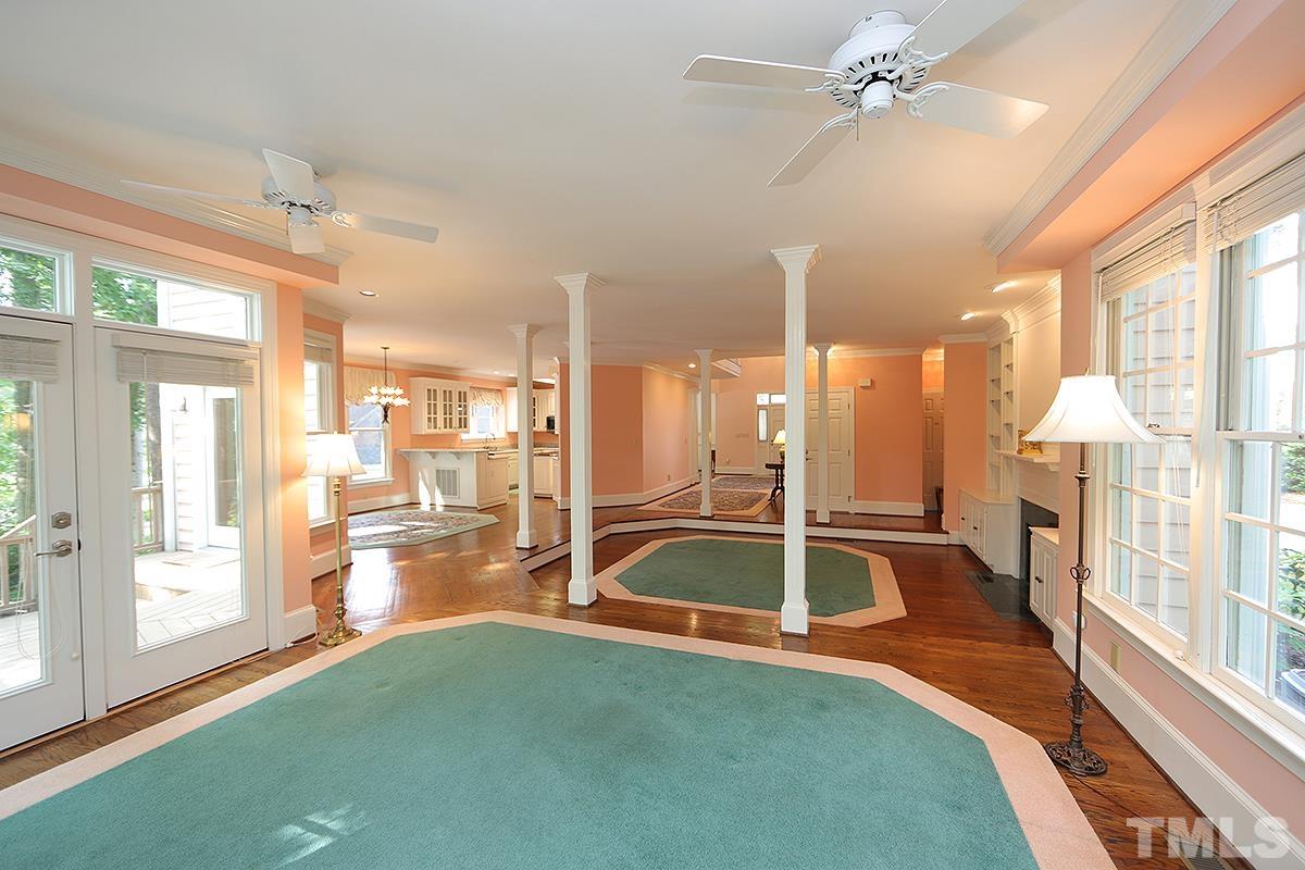 7600 Pinewild Court Raleigh, NC 27615 - Photo 18 of 52 a view of a living room and chandelier fan