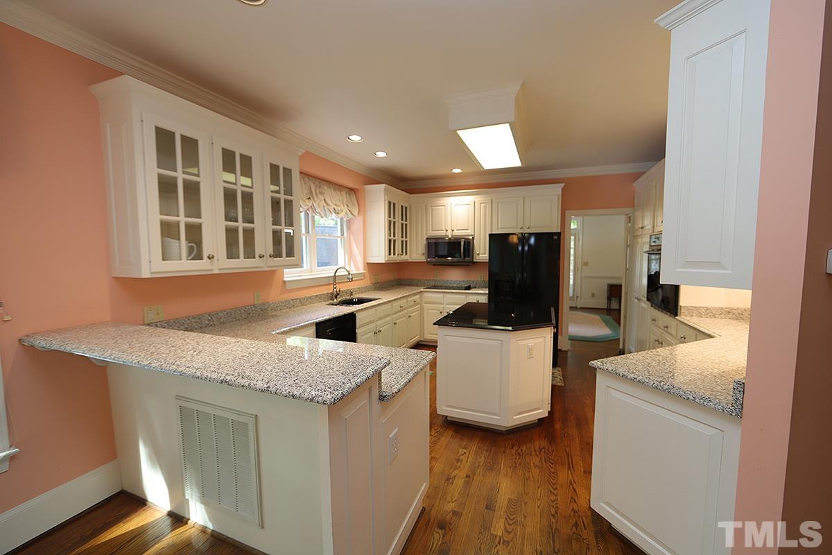 7600 Pinewild Court Raleigh, NC 27615 - Photo 19 of 52 a kitchen with sink and refrigerator