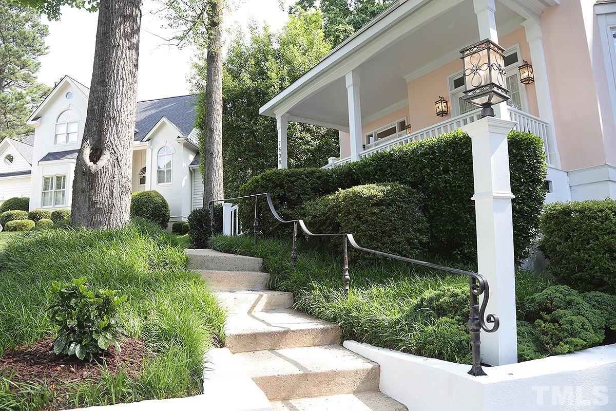 7600 Pinewild Court Raleigh, NC 27615 - Photo 2 of 52 a front view of a house with garden
