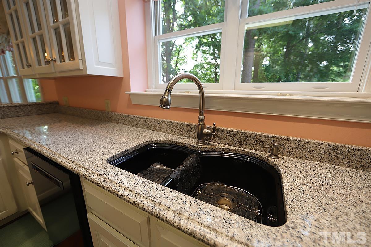 7600 Pinewild Court Raleigh, NC 27615 - Photo 22 of 52 a kitchen with a sink and a large window
