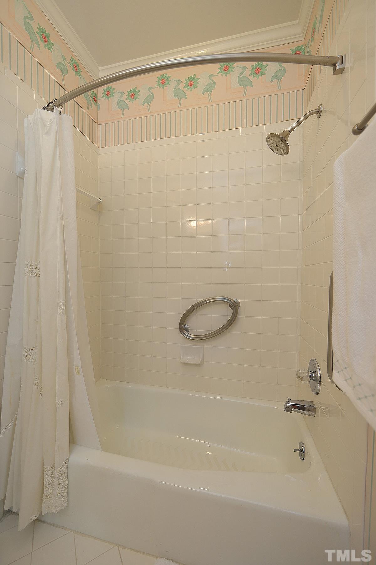 7600 Pinewild Court Raleigh, NC 27615 - Photo 35 of 52 a bathroom with a shower and a bath tub