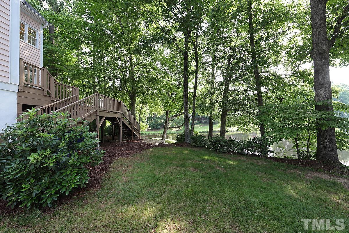 7600 Pinewild Court Raleigh, NC 27615 - Photo 47 of 52 a view of a big yard with plants and large trees