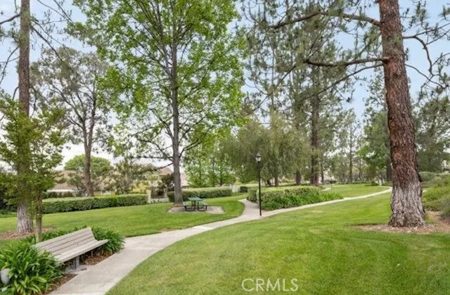 a patio with a yard table and chairs