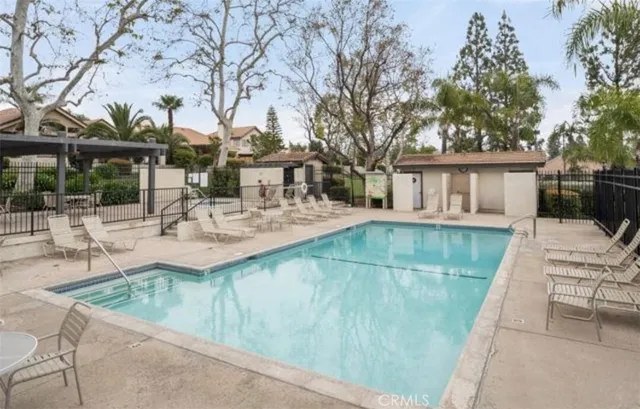 a view of a yard with plants and trees