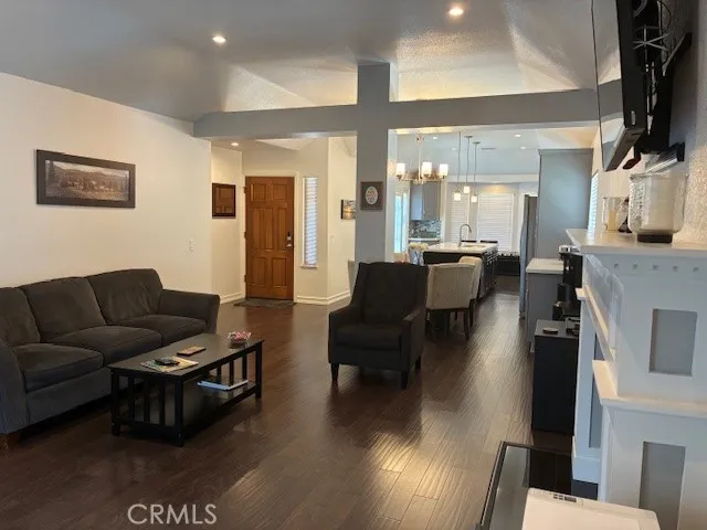a living room with fireplace furniture and a flat screen tv