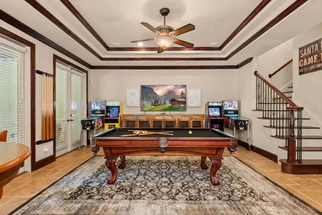 a living room with furniture a rug and a chandelier