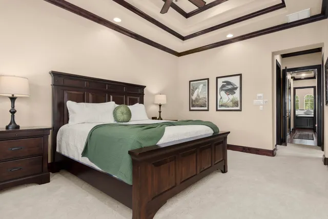 a large kitchen with kitchen island granite countertop a large window and stainless steel appliances