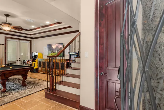 a view of entryway and hall with wooden floor