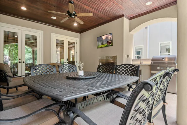 a view of a house with swimming pool next to a yard