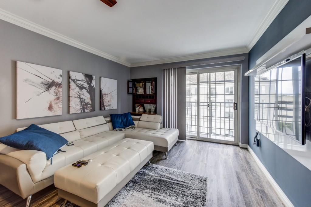 199 14th Street Northeast, Unit 609 Atlanta, GA 30309 - Photo 1 of 1 a living room with furniture and a large window