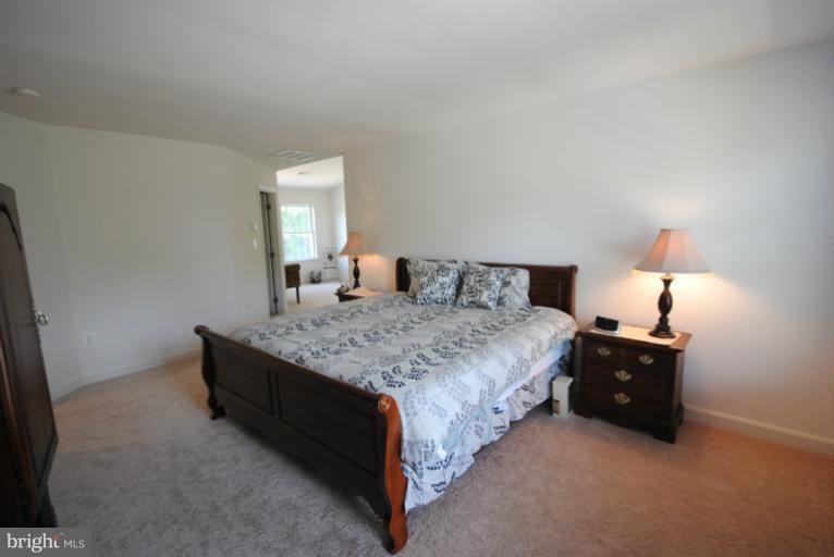 20334 Cliftons Point Street Sterling, VA 20165 - Photo 16 of 30 a bedroom with a bed and window