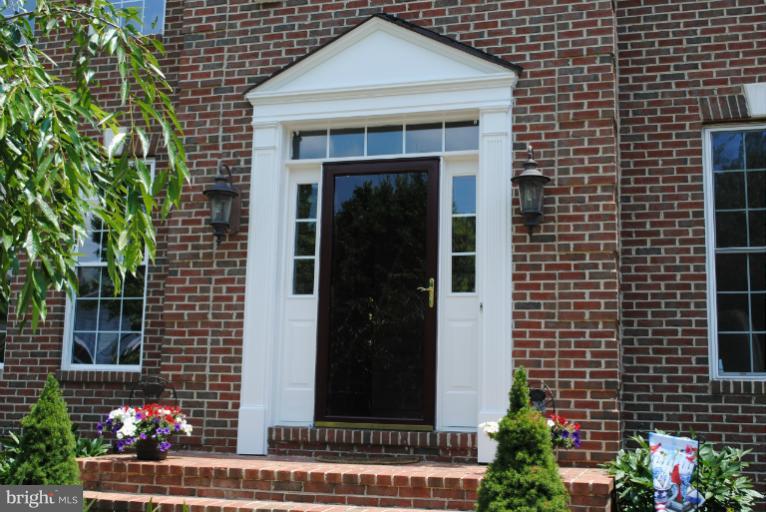 20334 Cliftons Point Street Sterling, VA 20165 - Photo 19 of 30 a front view of a house with a garden