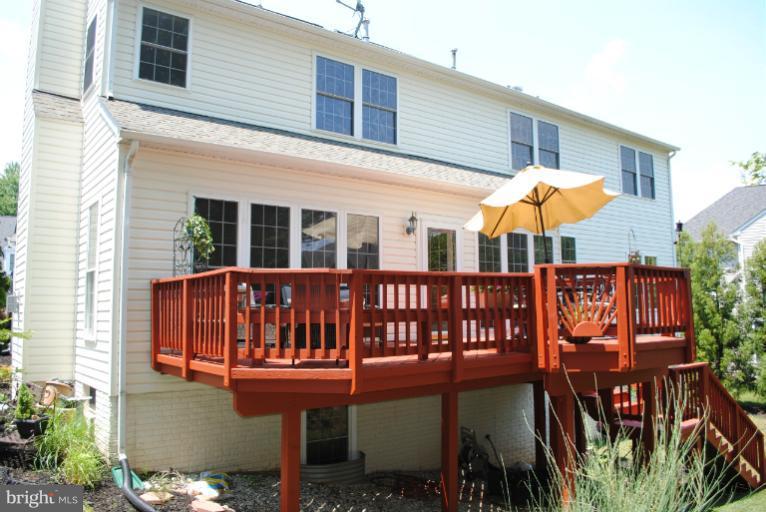 20334 Cliftons Point Street Sterling, VA 20165 - Photo 26 of 30 a view of a house with backyard and sitting area