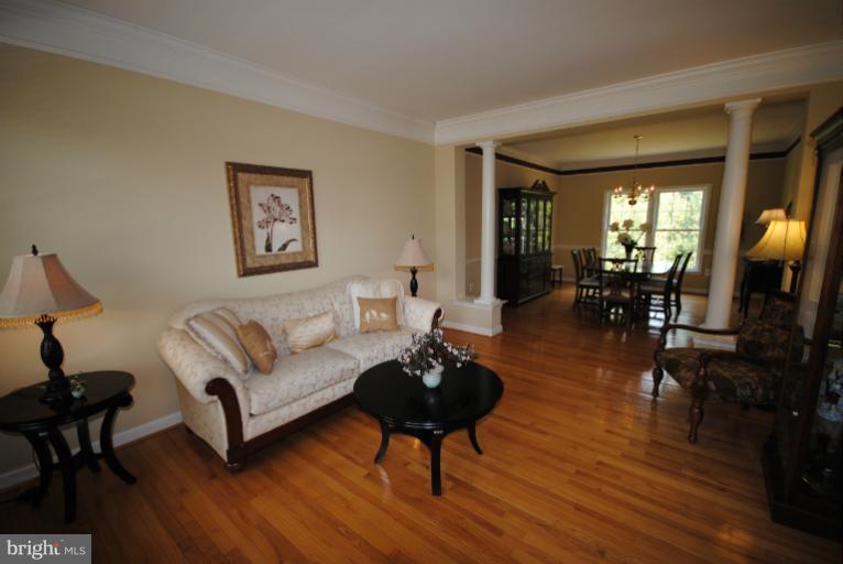 20334 Cliftons Point Street Sterling, VA 20165 - Photo 4 of 30 a living room with furniture and a large window