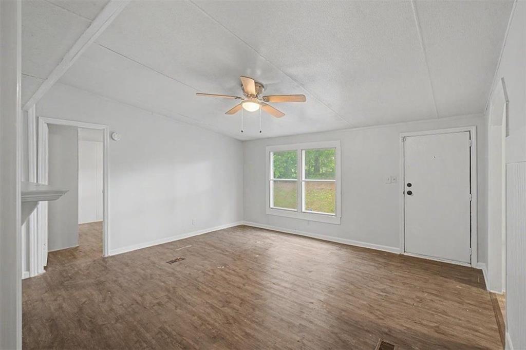 360 Black Knob Church Road Ranger, GA 30734 - Photo 6 of 20 a view of a room with a ceiling fan and a window
