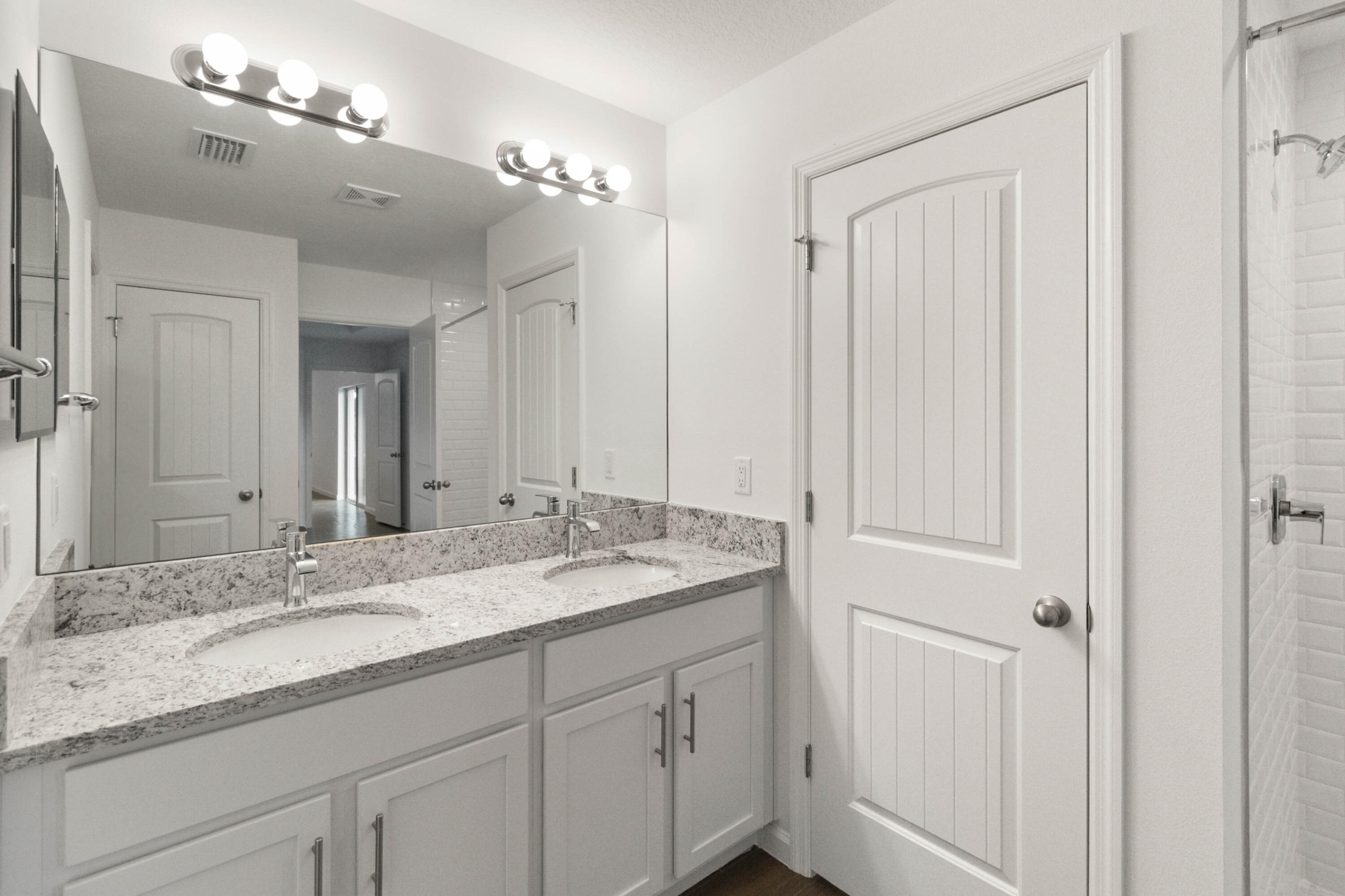 336 Rheine Road Northwest Palm Bay, FL 32907 - Photo 21 of 30 a bathroom with a double vanity sink and a mirror