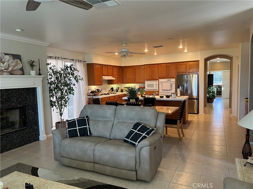31458 Inverness Court Temecula, CA 92591 - Photo 12 of 33 a living room with furniture and a fireplace