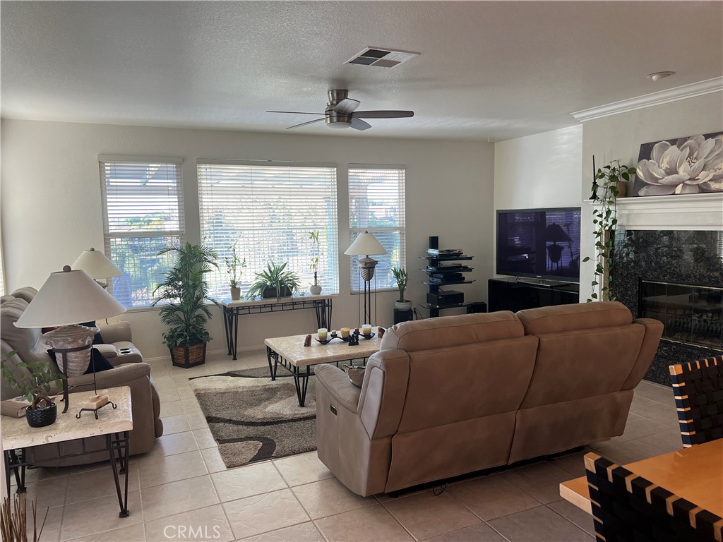 31458 Inverness Court Temecula, CA 92591 - Photo 13 of 33 a living room with furniture and a fireplace