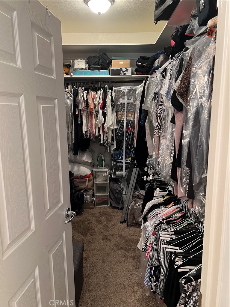 31458 Inverness Court Temecula, CA 92591 - Photo 22 of 33 a view of walk in closet with clothes and shoes