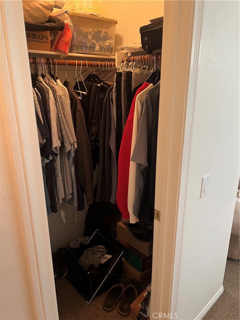 31458 Inverness Court Temecula, CA 92591 - Photo 28 of 33 a view of walk in closet with clothes and shoes