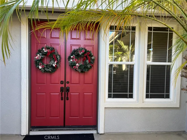 a view of a house with a door and a window