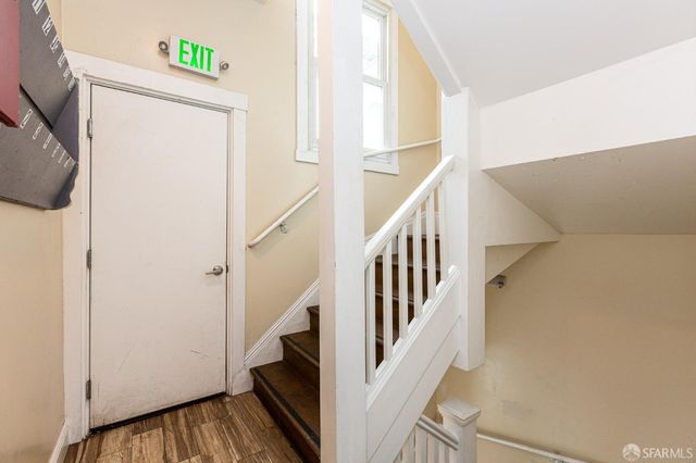 a view of a bathroom from a hallway