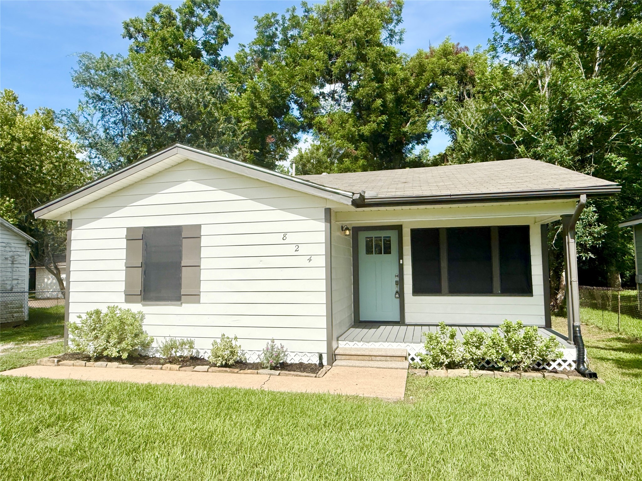 front view of a house with a yard