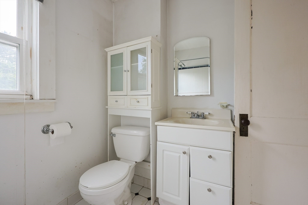 29 Margaret Road Newton, MA 02461 - Photo 18 of 33 a bathroom with a toilet a sink and mirror