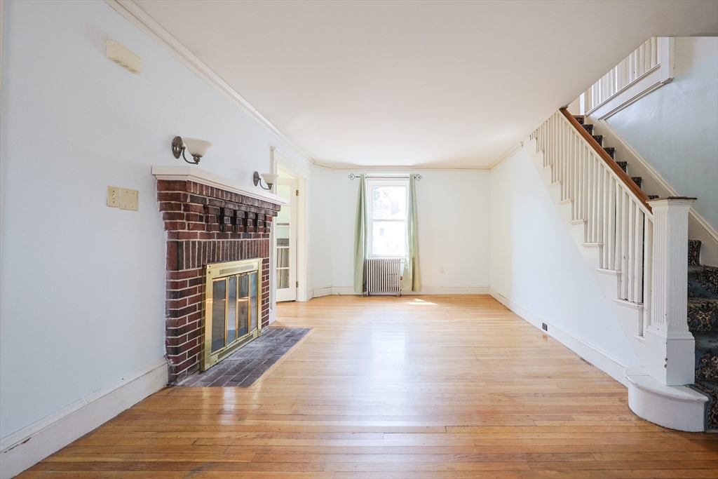 29 Margaret Road Newton, MA 02461 - Photo 3 of 33 a view of empty room with wooden floor and fan