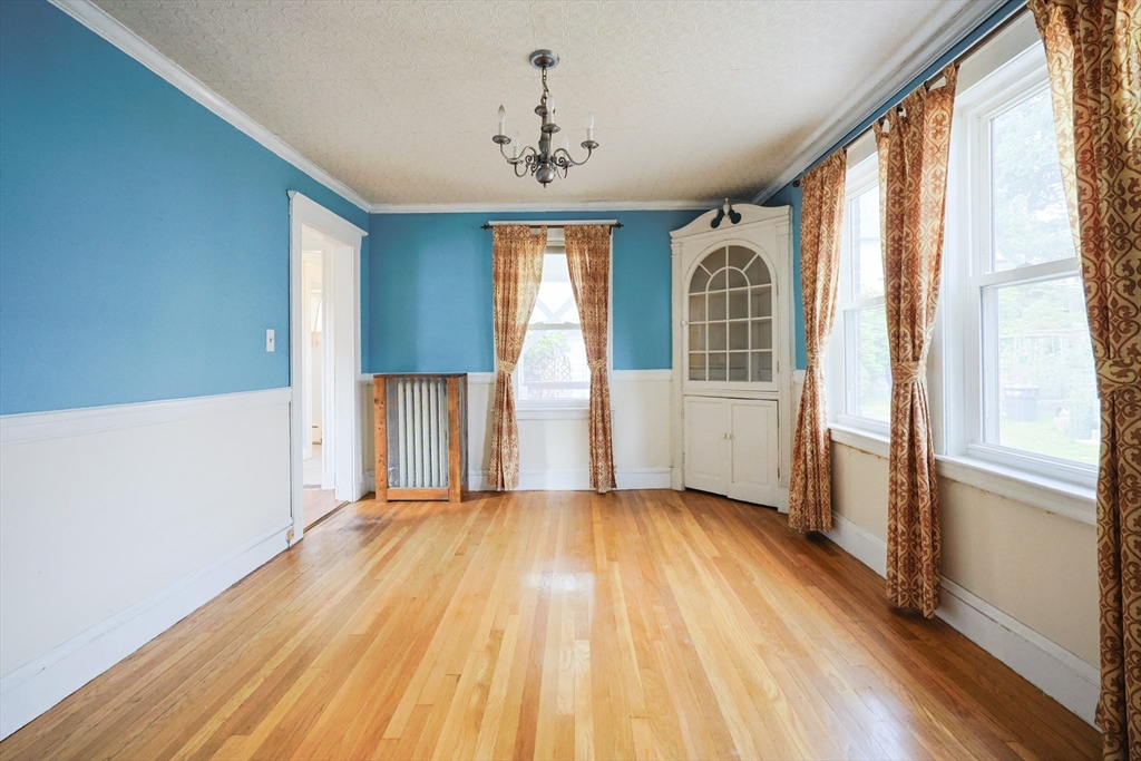 29 Margaret Road Newton, MA 02461 - Photo 8 of 33 a view of a big room with wooden floor and windows