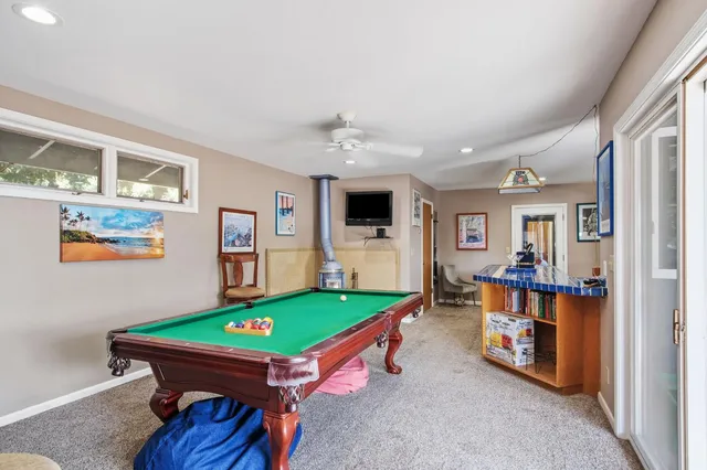 a bathroom with a sink and a mirror with toilet