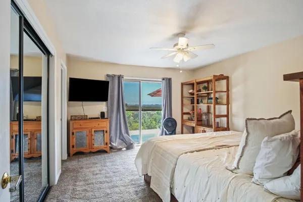 a bedroom with furniture and window