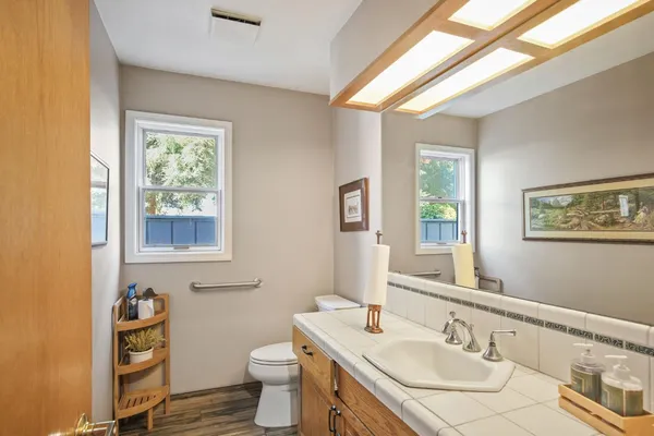 a spacious bathroom with a double vanity sink mirror and double