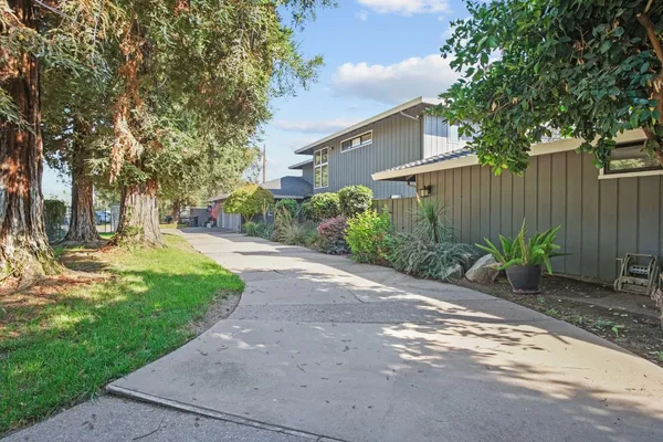 a front view of a house with garden