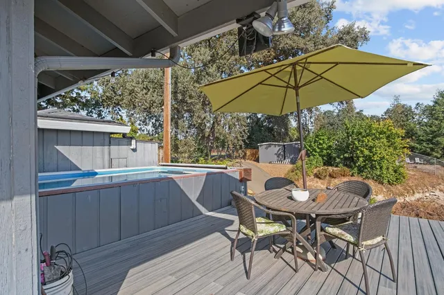 an aerial view of a house with a yard basket ball court and outdoor seating