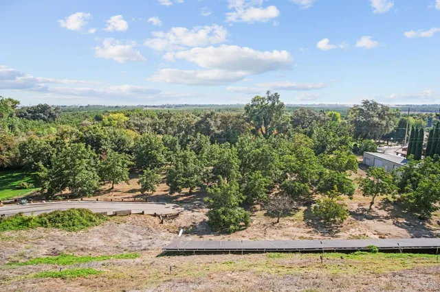 a view of a swimming pool with a yard