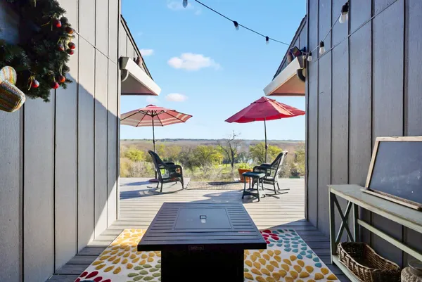 an aerial view of a house with a yard basket ball court and outdoor seating