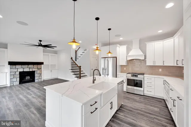 a view of a kitchen with furniture and a fireplace