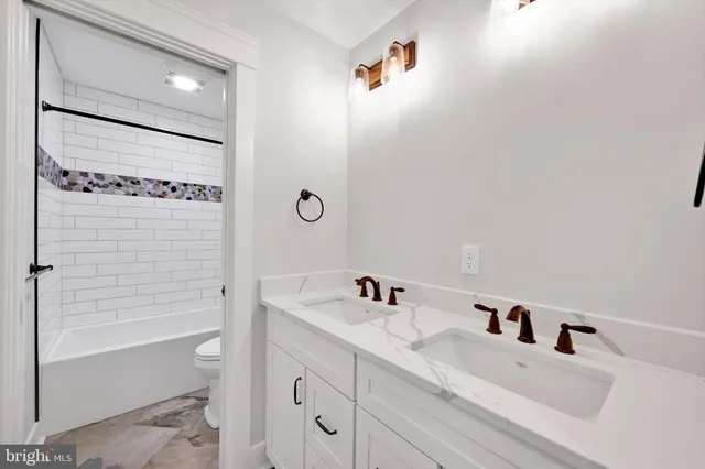 a bathroom with a bathtub and shower