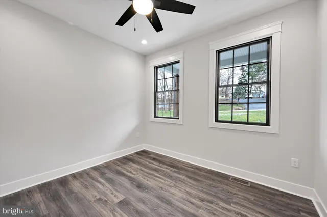 a view of an entryway with wooden floor