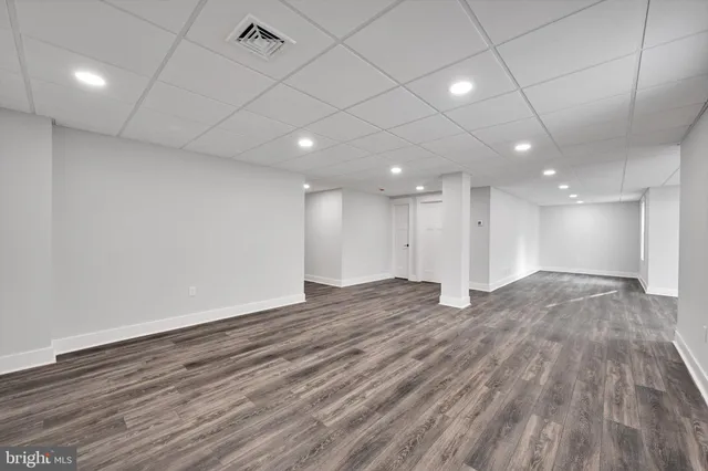 a view of room with wooden floor