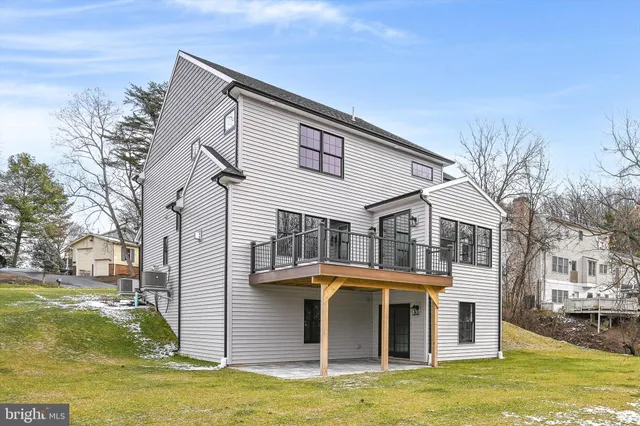 an aerial view of a house with outdoor space