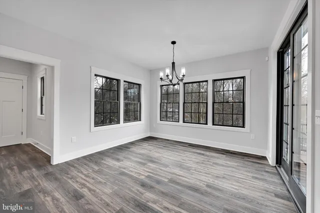 a view interior of a house wooden floor and a chandelier