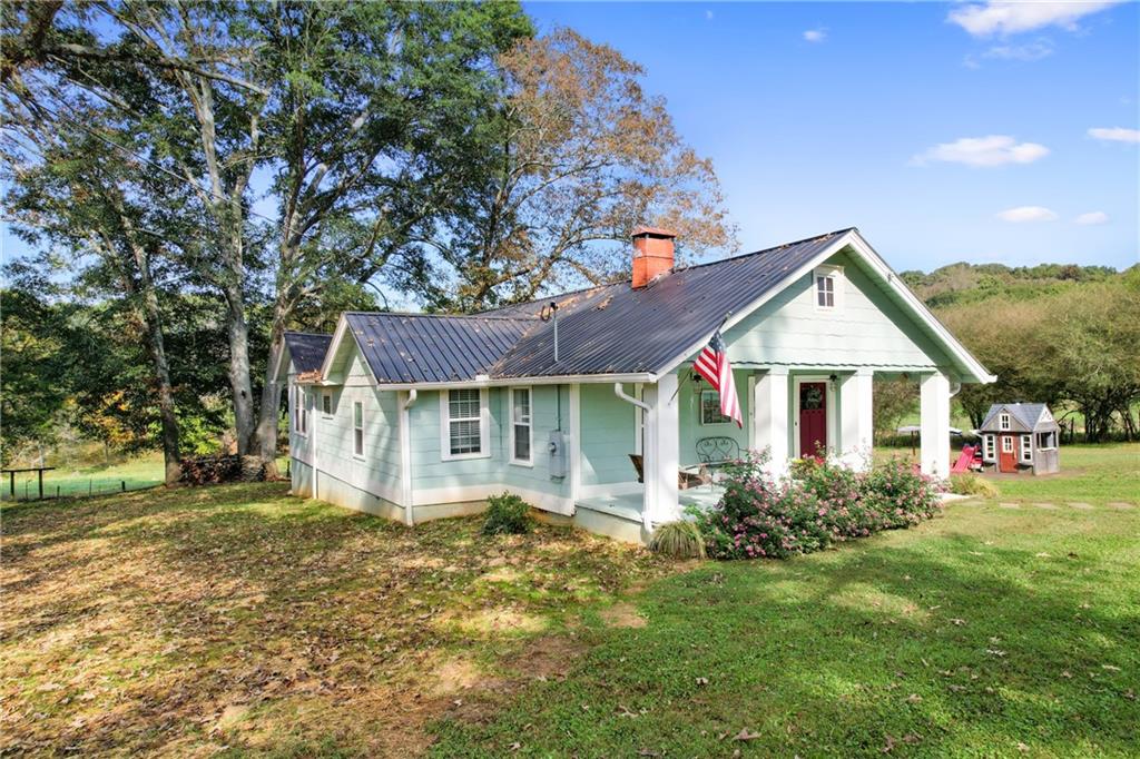4268 Hunter Road Gainesville, GA 30506 - Photo 1 of 1 a front view of house with yard and green space