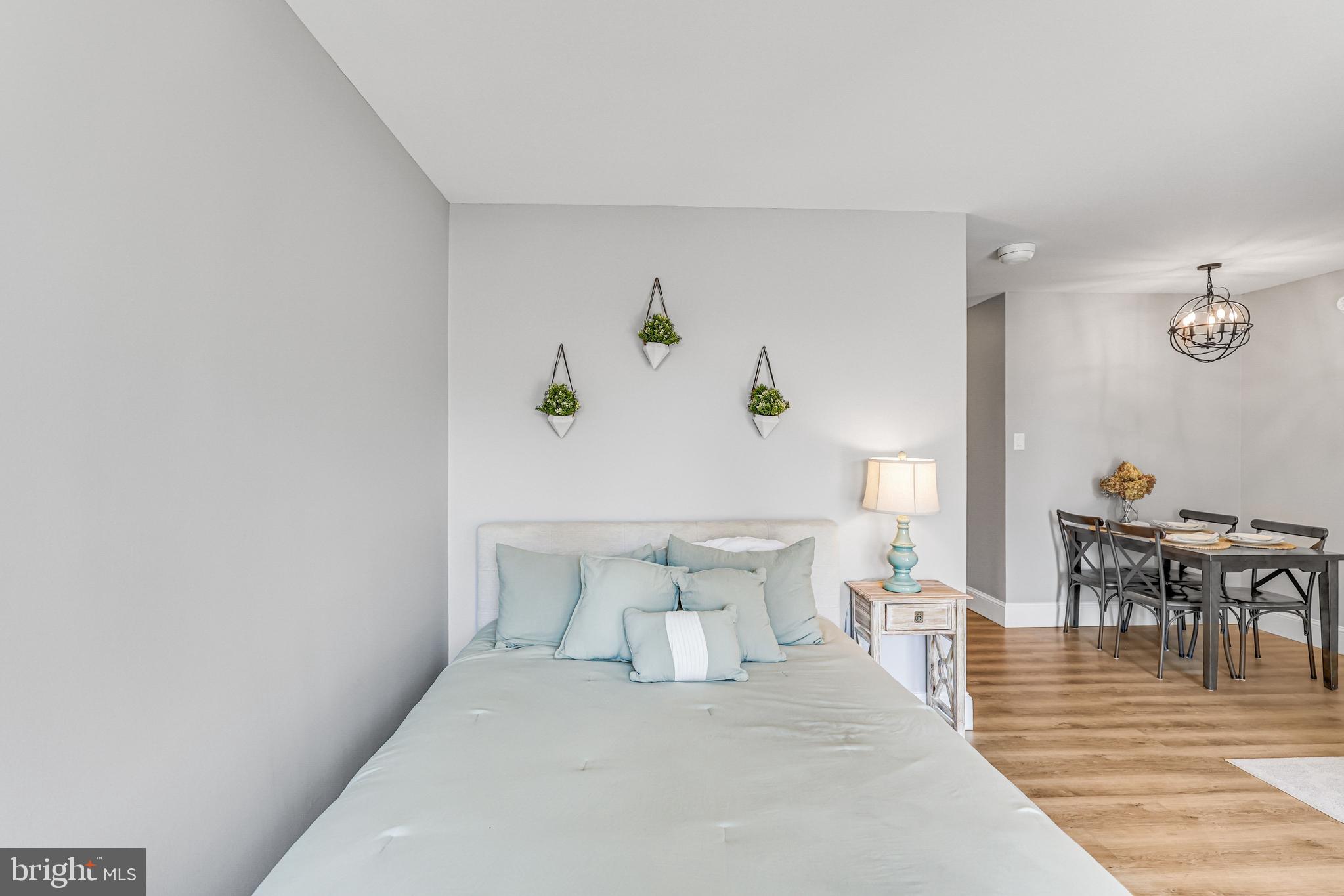 300 M Street Southwest, Unit N102 Washington, DC 20024 - Photo 15 of 53 a bedroom with a bed and a table