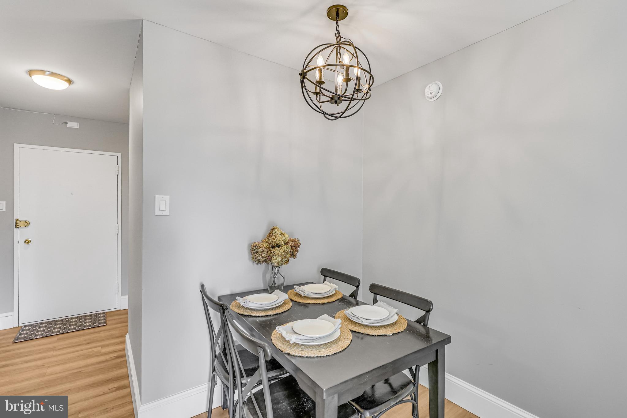 300 M Street Southwest, Unit N102 Washington, DC 20024 - Photo 18 of 53 a view of a dining room with furniture and chandelier