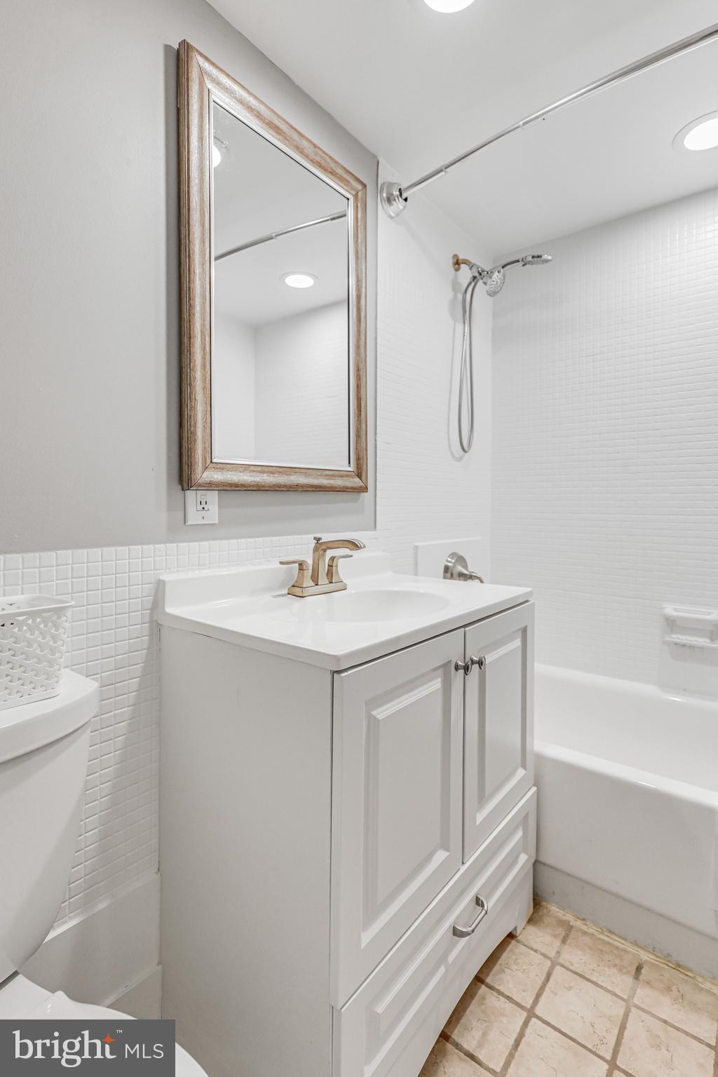 300 M Street Southwest, Unit N102 Washington, DC 20024 - Photo 22 of 53 a bathroom with a sink a toilet and shower