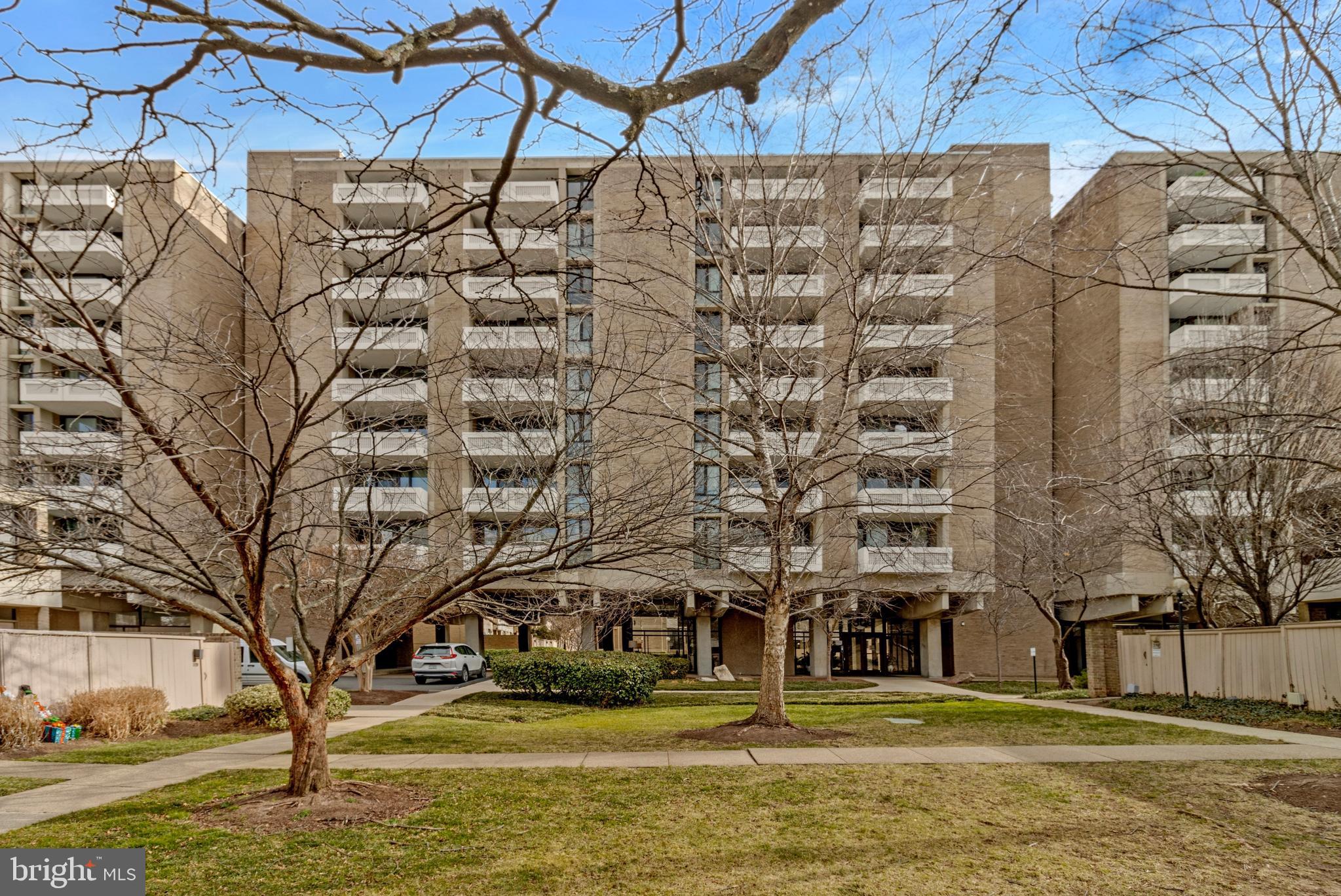 300 M Street Southwest, Unit N102 Washington, DC 20024 - Photo 27 of 53 a building with trees in front of it